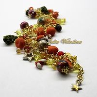 Браслет "Красно-желтый Мандариновый Новый год" в красно-желтой-золотой гамме с множеством мельчайших элементов.Елочные шары, шишки, мандарины елочки, леденцы, звездочки! 1350 руб